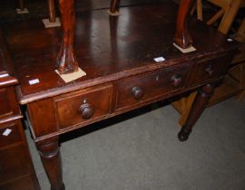 An early 20th century stained pine side table centred with long drawer flanked by two short drawers,