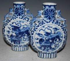 A pair of Chinese blue and white porcelain pilgrim vases/ moon flasks, Qing Dynasty, decorated on