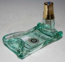 A vintage Teachers Highland Cream Scotch Whisky bottle re-fashioned as an ashtray.