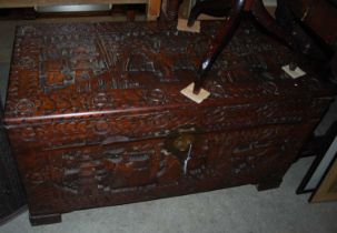 A Chinese carved camphor wood blanket box.