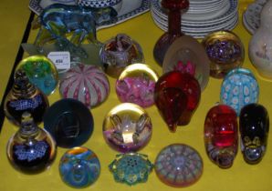 A collection of art glass paperweights to include examples by Caithness Glass, Wedgwood, Selkirk