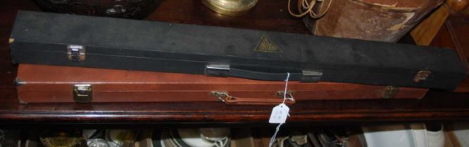 A cased Stephen Hendry edition Lindop snooker cue, together with a cased Riley Prestige snooker cue.