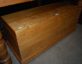 A pine blanket box.