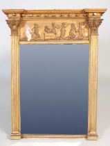 An 19th century Regency style giltwood wall mirror, the frieze decorated in relief with dancing