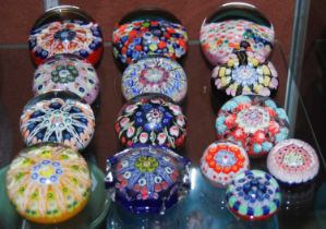 A group of fourteen assorted Scottish art glass paperweights.