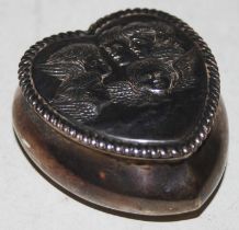 A Birmingham silver heart-shaped box, the hinged cover embossed with cherubs heads, makers mark