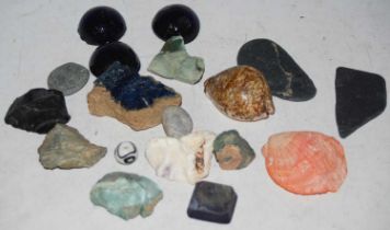 A collection of beach-found shells, stones and sea glass.