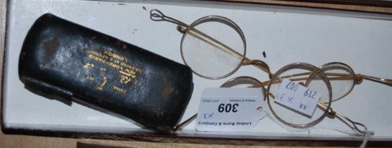 A group of three assorted vintage gold-coloured spectacles to include a cased set by 'EB