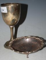 A Birmingham silver goblet together with a shaped circular silver bonbon dish raised on three