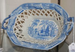 A 19th century Davenport blue printed octagonal-shaped pottery basket, decorated with a scene of two