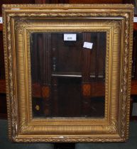 A gilt picture frame with glass panel.