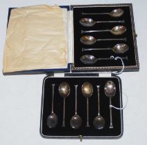 A cased set of six Birmingham silver coffee spoons, together with another similar cased set of