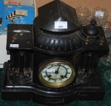 A slate marble clock with Roman numeral dial and twin train movement.