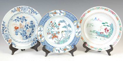 A group of three Chinese porcelain plates, Qing Dynasty, comprising; a blue and white plate
