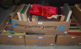 Four boxes of assorted vintage books.