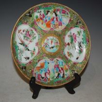 A Chinese porcelain famille rose Canton plate, Qing Dynasty, 20.5cm diameter.