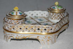 A Herend porcelain desk stand set with two integral inkwells, each with detachable cover and