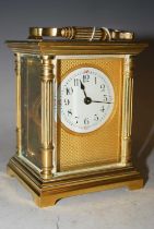 A 20th century brass cased carriage clock with Arabic numeral dial.