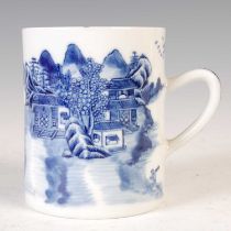 An 18th century Chinese porcelain blue and white tankard, decorated with a Chinese river