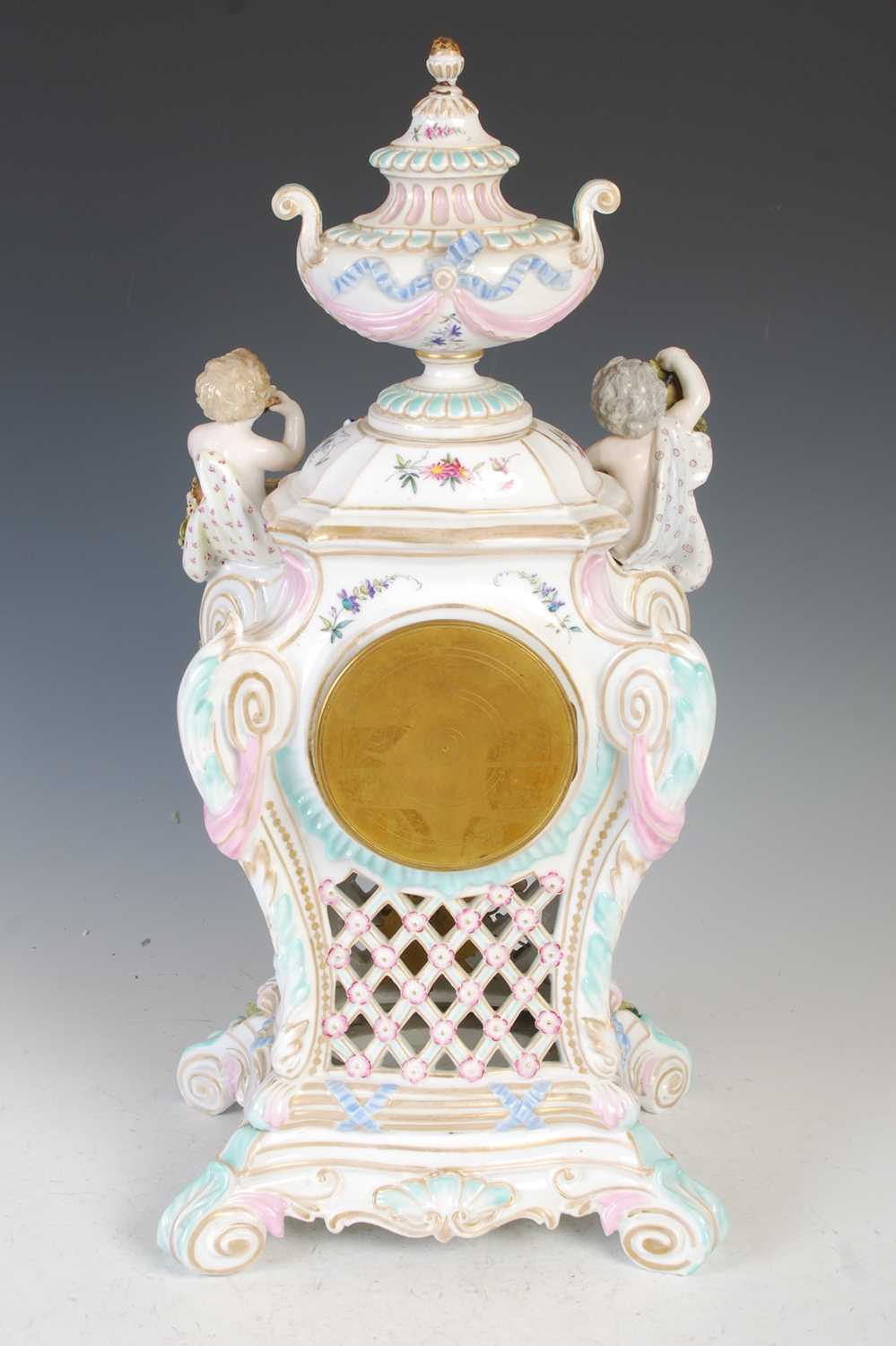 A late 19th / early 20th century Dresden porcelain mantle clock, the circular blue and white - Image 6 of 8