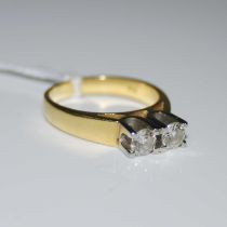 A mid-20th century yellow and white metal two stone diamond ring stamped '18CT', ring size M,