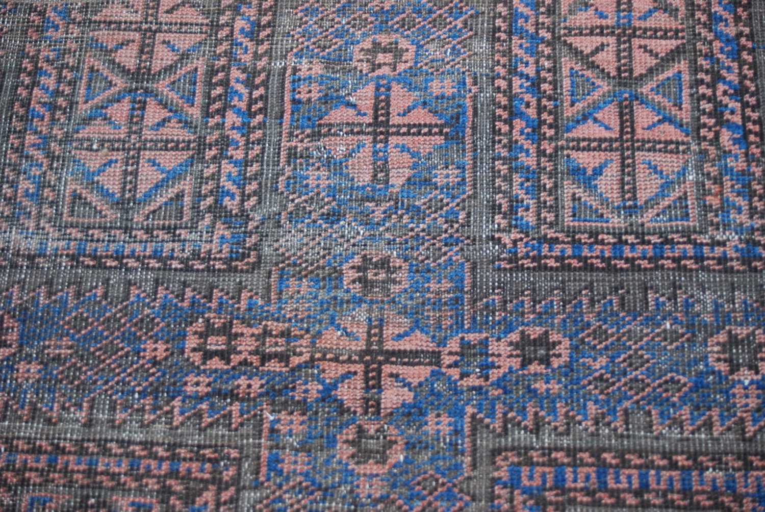 A Persian rug, early 20th century, the rectangular field centred with a cross form motif worked in - Image 4 of 5
