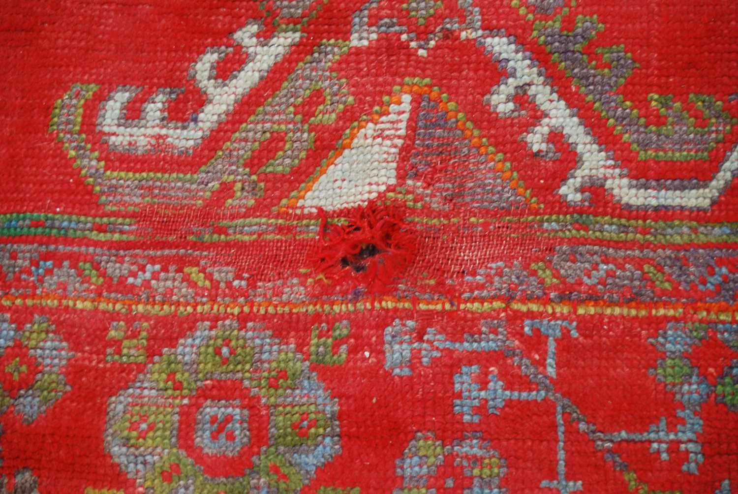 A late 19th century red ground Ushak carpet, the rectangular field decorated with three rows of - Image 6 of 9