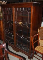 A late 19th / early 20th century mahogany astragal glazed two door bookcase with four adjustable