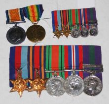 A group of WWI and WWII medals to include a pair of Great War medals inscribed to 'Capt. H.