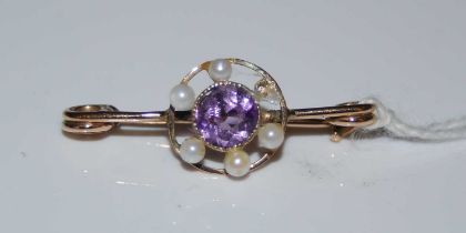 A vintage 9ct gold, amethyst and pearl set brooch (one pearl missing).