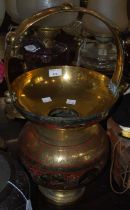 An Indian brass Holy water pot with engraved details of stylised flowers, the central border with