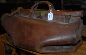 A vintage brown leather gladstone / doctors bag.