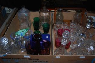 Two boxes of assorted glassware to include various decanters, a whisky tantalus, etc.