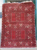 A Persian Tekke type rug, early 20th century, centred with two rectangular fields on a ground of