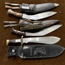 Two vintage kukri knives each with companion knives, together with a 'Ranger 440-A Super Stainless