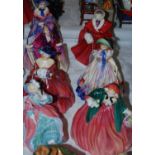 A group of seven Royal Doulton lady figures comprising 'A Victorian Lady' HN728, 'The Skater'