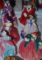 A group of seven Royal Doulton lady figures comprising 'A Victorian Lady' HN728, 'The Skater'