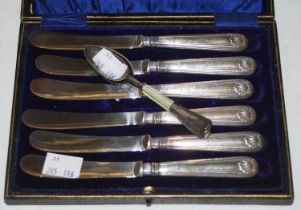 A cased set of six silver handled afternoon tea knives, and three silver teaspoons.