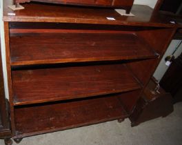 A mahogany open bookcase.