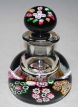 A vintage Scottish black ground millefiori set inkwell and stopper, 12cm high