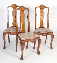 A set of three 19th century Dutch mahogany and marquetry inlaid side chairs, the vase-shaped