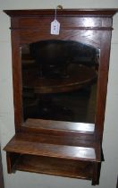 An early 20th century oak hall mirror, together with a Victorian oak coal scuttle.