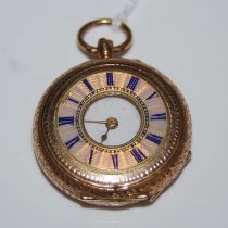 A vintage yellow metal and enamel half-hunter fob watch, with black and white Roman numeral dial,