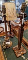 Three assorted antique wooden table lamps.