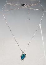 A white metal necklace stamped '18k WG', suspending a white metal opal and diamond set pendant