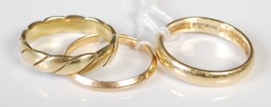 Three assorted 18ct gold rings, gross weight 11.6 grams.