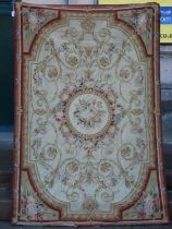 An Aubusson flatweave rug / wall hanging, the ivory coloured ground decorated with flowers and