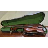 An antique violin in a fitted black case, with inscribed paper label 'Nicolaus Amatus Cremonen