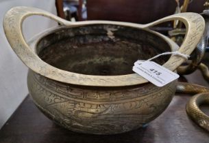 A Chinese gilt metal twin handled censer with incised details of dragons and mythical birds.