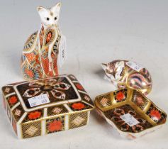 A collection of Royal Crown Derby to include a seated cat with gold button, another cat with gold